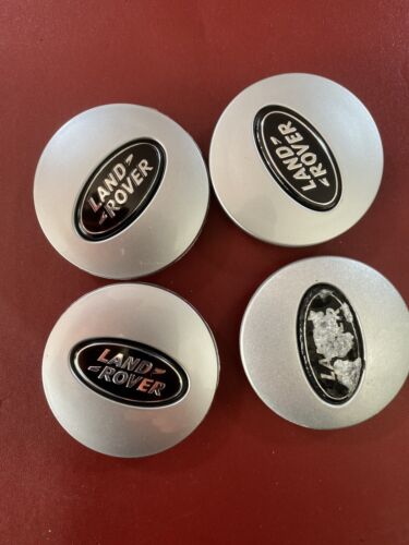 Used Land Rover 63mm wheel centre caps RRJ500030XXX Black and Silver Grade B.