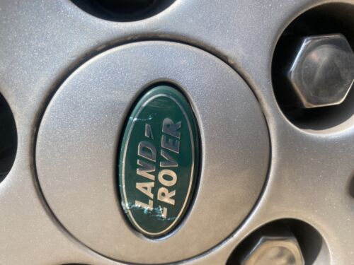 Used Land Rover 63mm wheel centre caps RRJ500030XXX Green and Silver Grade B