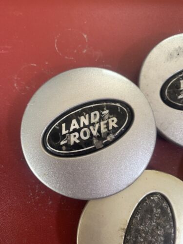 Used Land Rover 63mm wheel centre caps RRJ500030XXX Black and Silver Grade B
