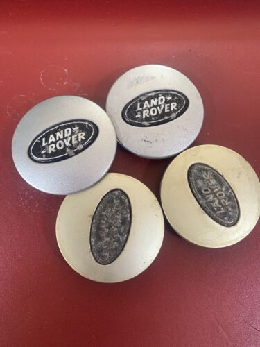 Used Land Rover 63mm wheel centre caps RRJ500030XXX Black and Silver Grade B