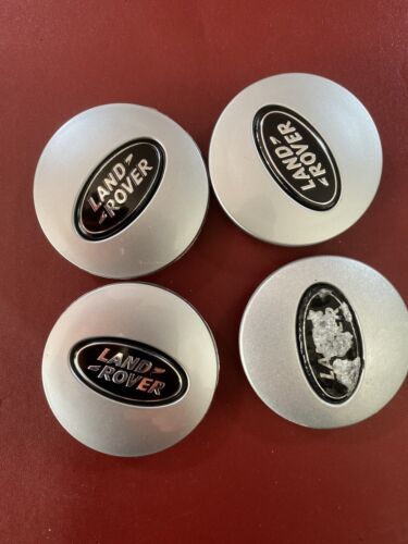 Used Land Rover 63mm  wheel centre caps RRJ500030XXX  Black and Silver Grade B.