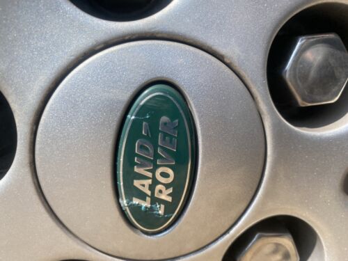 Used Land Rover 63mm  wheel centre caps RRJ500030XXX  Green and Silver Grade B