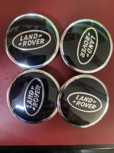 4X LAND ROVER BLACK ALLOY WHEEL CENTRE CAPS 63MM USED GRADE B.