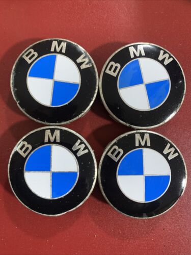 Four Bmw Centre Caps 68mm Across. poor condition, grade B