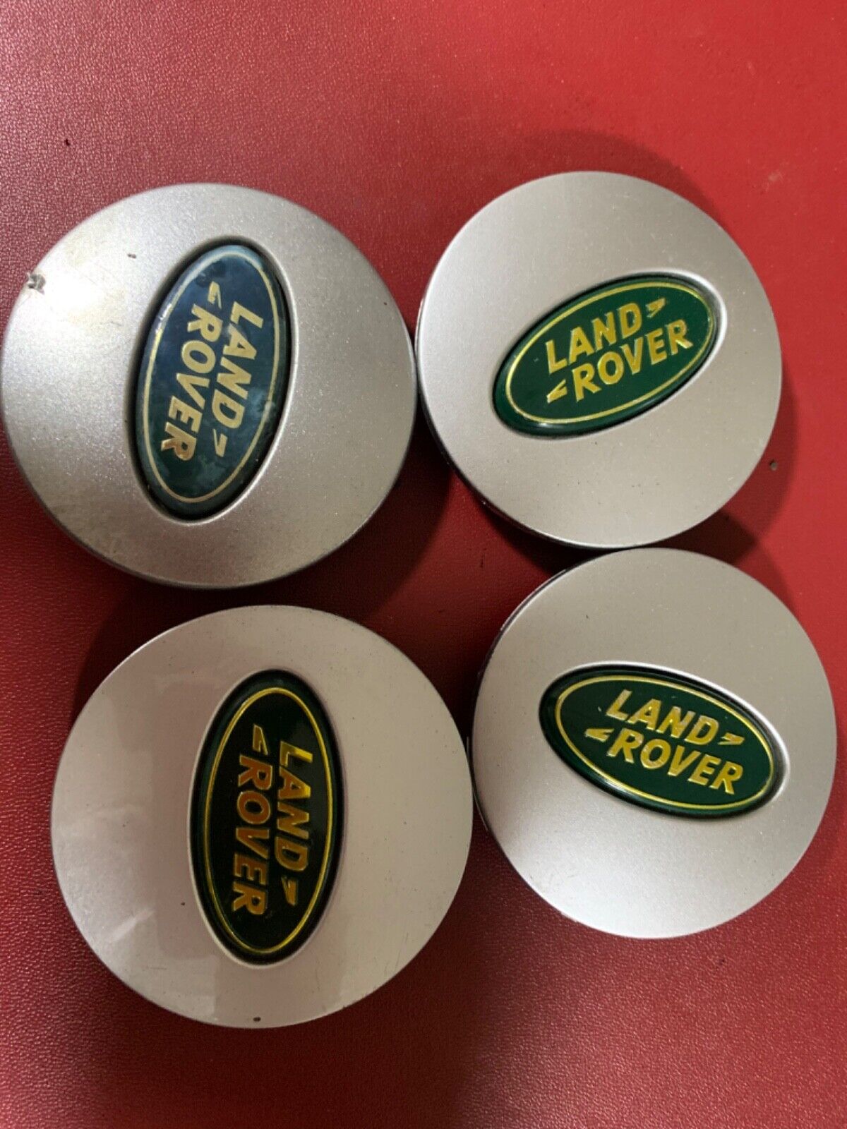 Set of used 4 Silver & Green Land Rover alloy wheel caps 63mm.